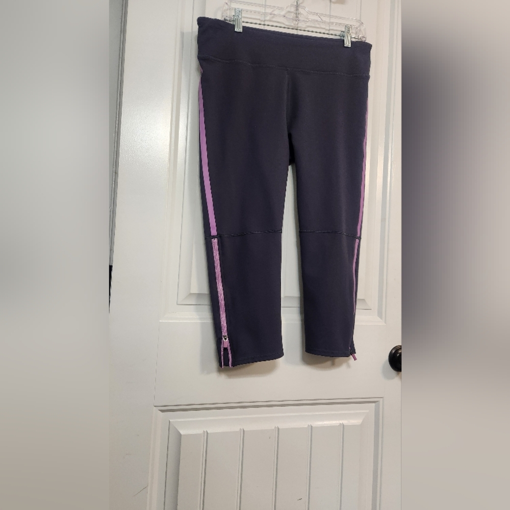 Fabletics Capri Leggings in Grey with Purple Accentsabel Strip With Lower Zipper